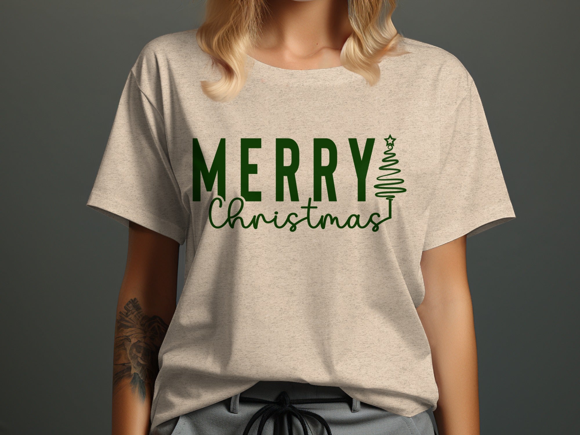 Light beige t-shirt with green text "MERRY Christmas" and a Christmas tree.