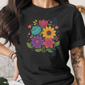Black t-shirt with colorful floral illustration and vertical stripes.