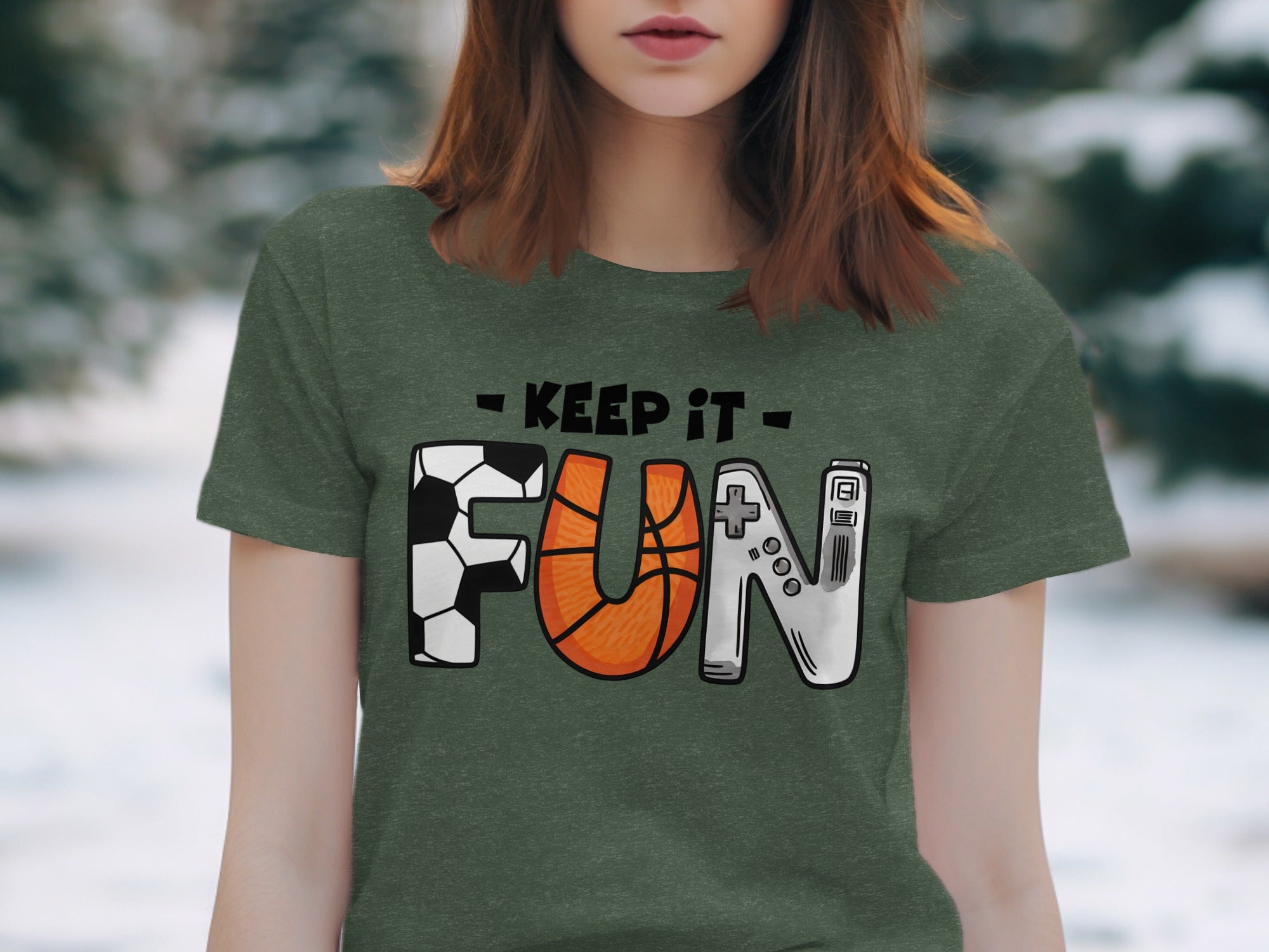 Green t-shirt with "Keep It FUN" design featuring football, basketball, and video game controller letters.