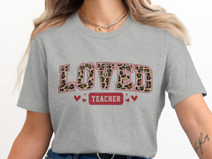 Grey t-shirt with large leopard print letters spelling "LOVED" and "TEACHER" below.