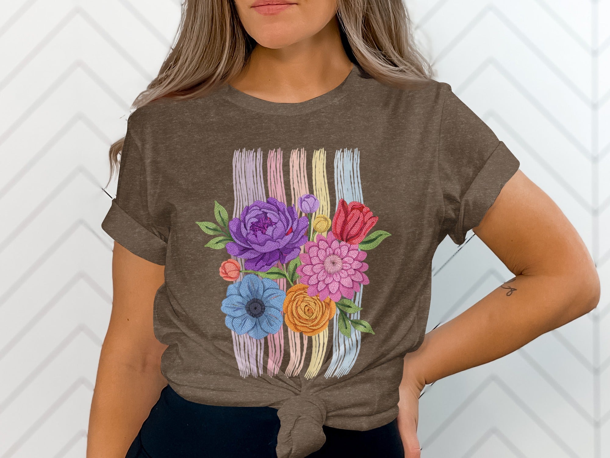 Brown t-shirt with a colorful floral bouquet and striped background design.