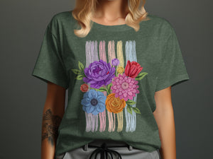 Green t-shirt with a colorful floral design on thin pastel stripes.