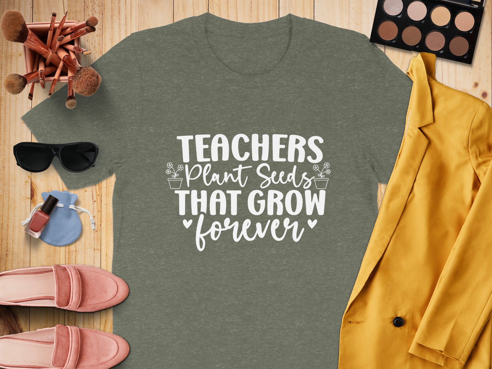 Olive green t-shirt with white text: "TEACHERS Plant Seeds THAT GROW forever"