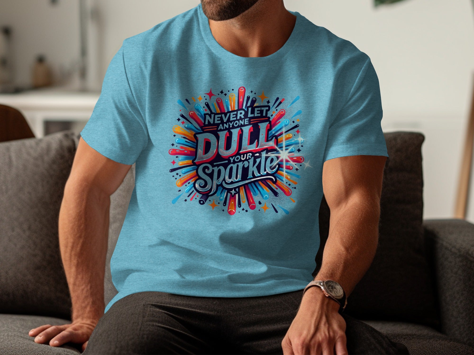 Light blue t-shirt with "Never Let Anyone Dull Your Sparkle" graphic.