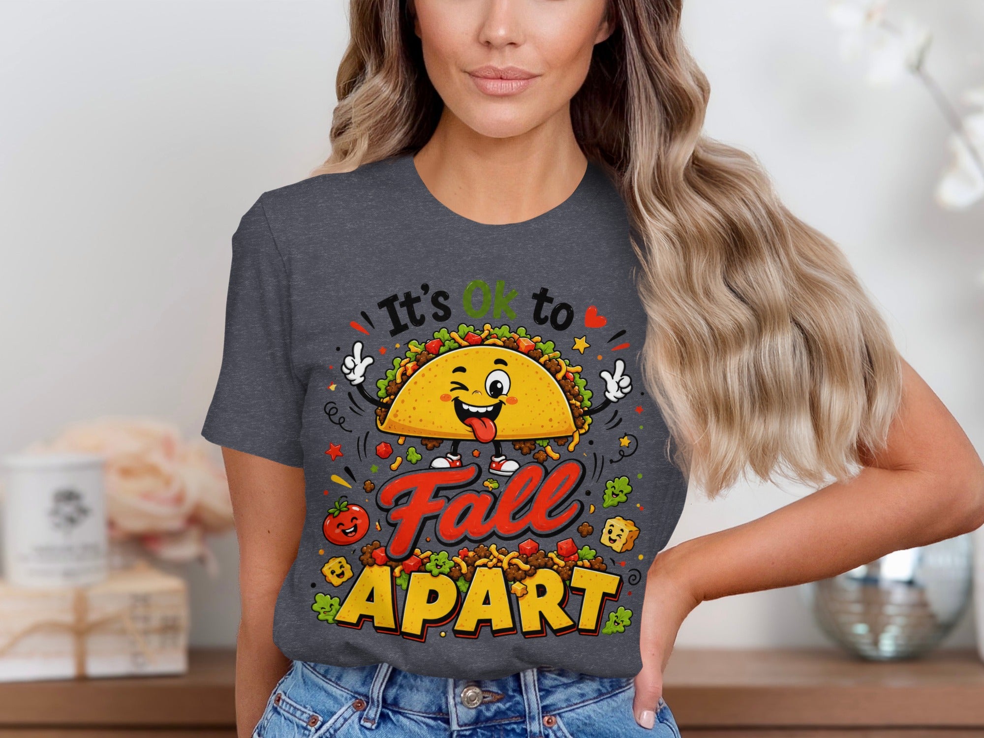 Taco graphic with text "It's OK to Fall Apart" on a t-shirt.