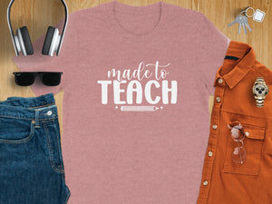 Pink t-shirt with “made to TEACH” text and pencil graphic.