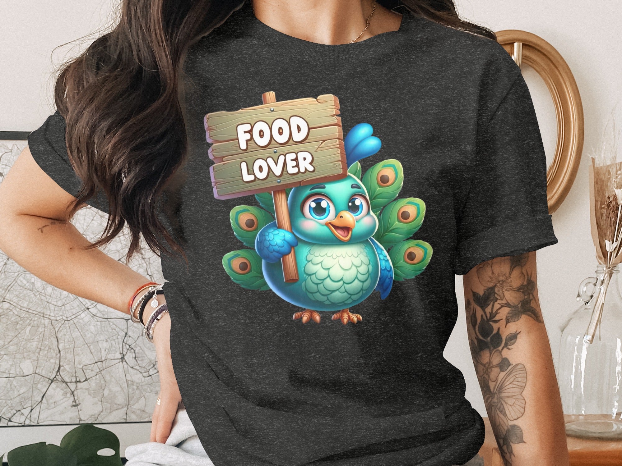 Cartoon peacock holding a wooden sign that says "FOOD LOVER".