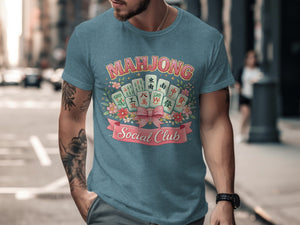 Blue t-shirt with "Mahjong Social Club" text and mahjong tiles surrounded by flowers.