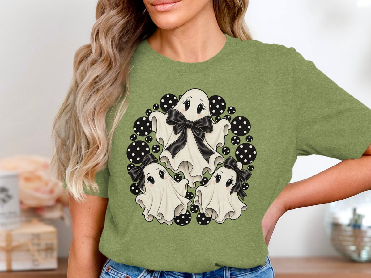Three cute ghosts with black bows surrounded by black and white polka dots.