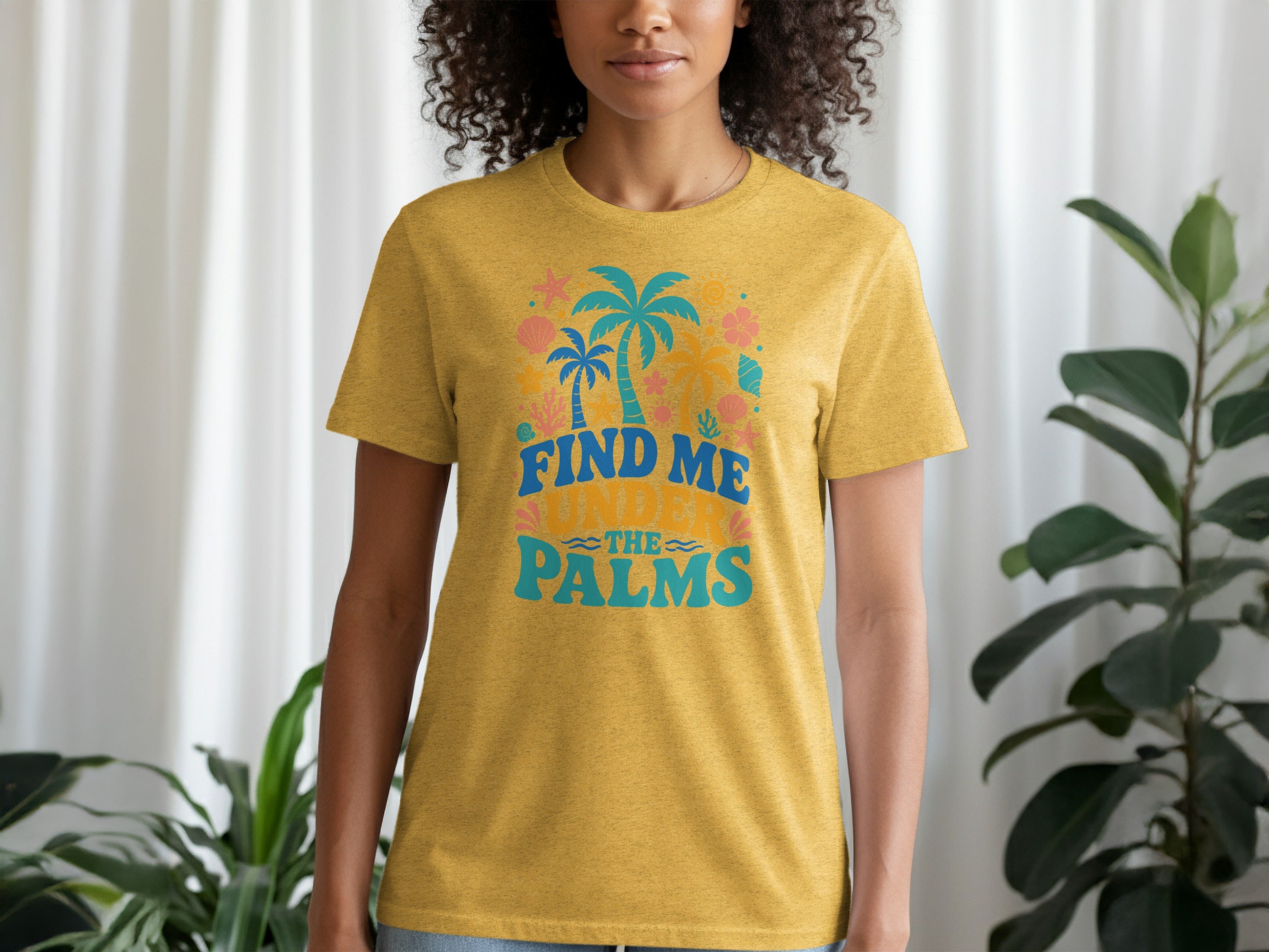 Yellow t-shirt with "Find me under the palms" text and tropical graphics.