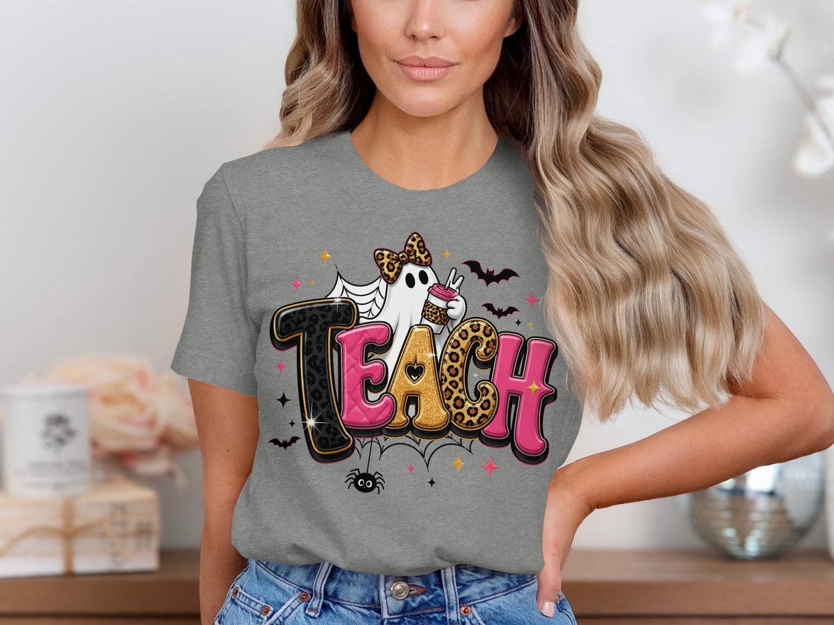 Ghost with leopard print bow holding coffee cup on grey t-shirt with word "TEACH".