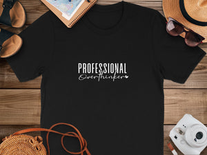 Black t-shirt with white text "PROFESSIONAL Overthinker"