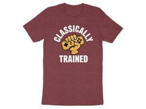 Maroon t-shirt with white text "CLASSICALLY TRAINED" and a cartoon hand holding a video game controller.