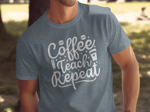 Grey t-shirt with white text "Coffee Teach Repeat," coffee beans, pencil, and cup.