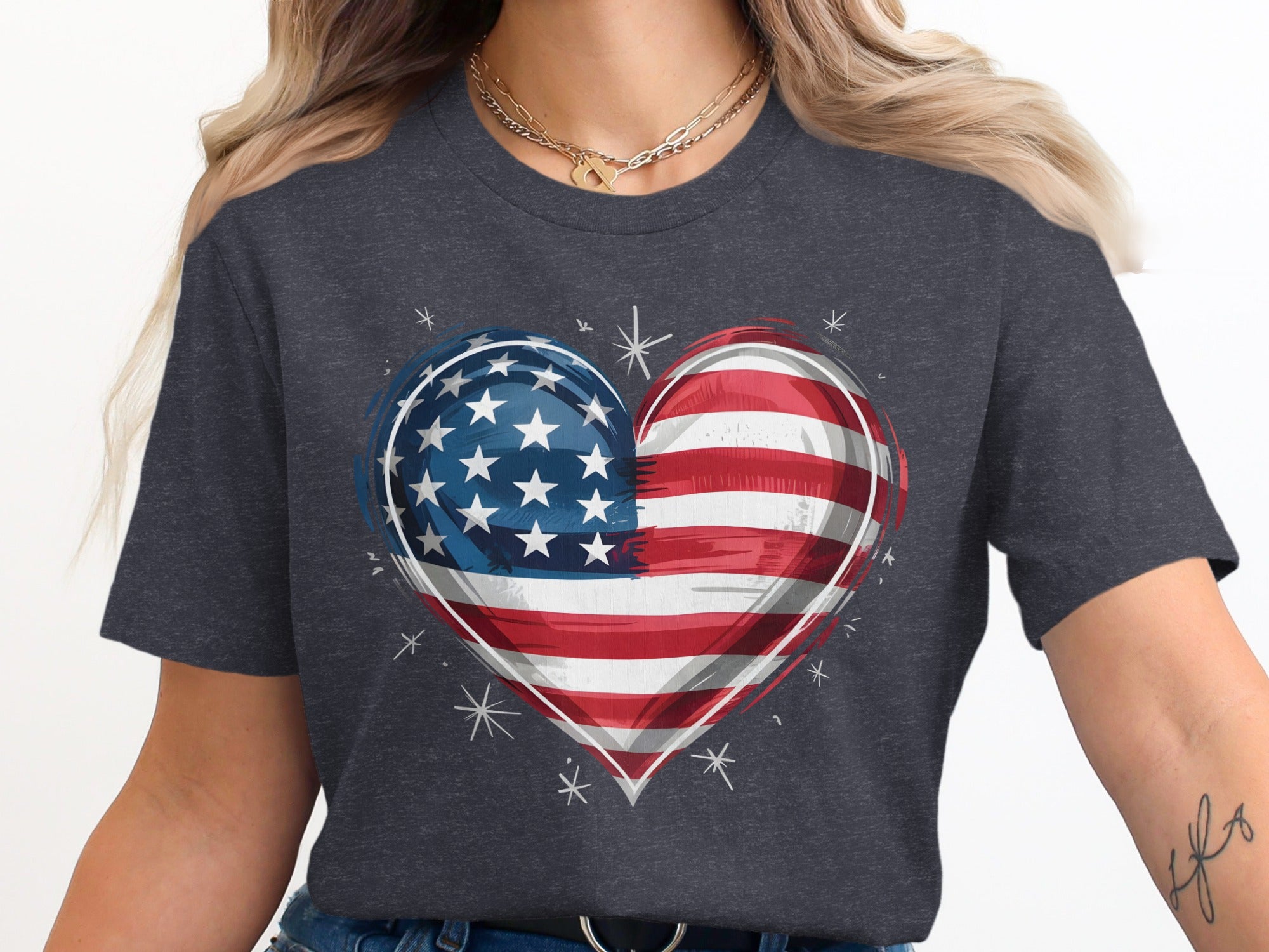 Dark t-shirt with American flag heart graphic and small white starbursts.
