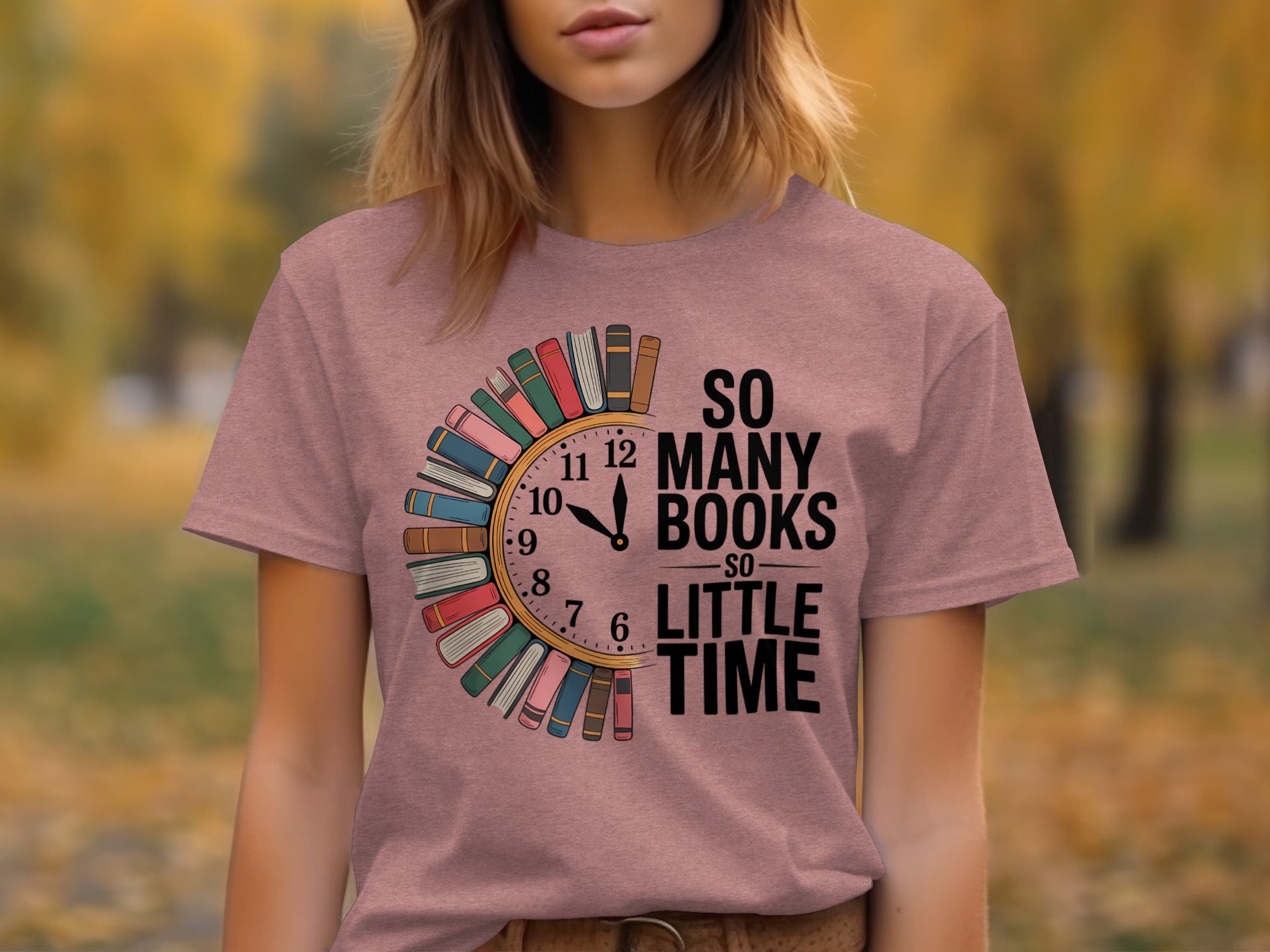Pink t-shirt with "So Many Books So Little Time" text and book-shaped clock graphic.