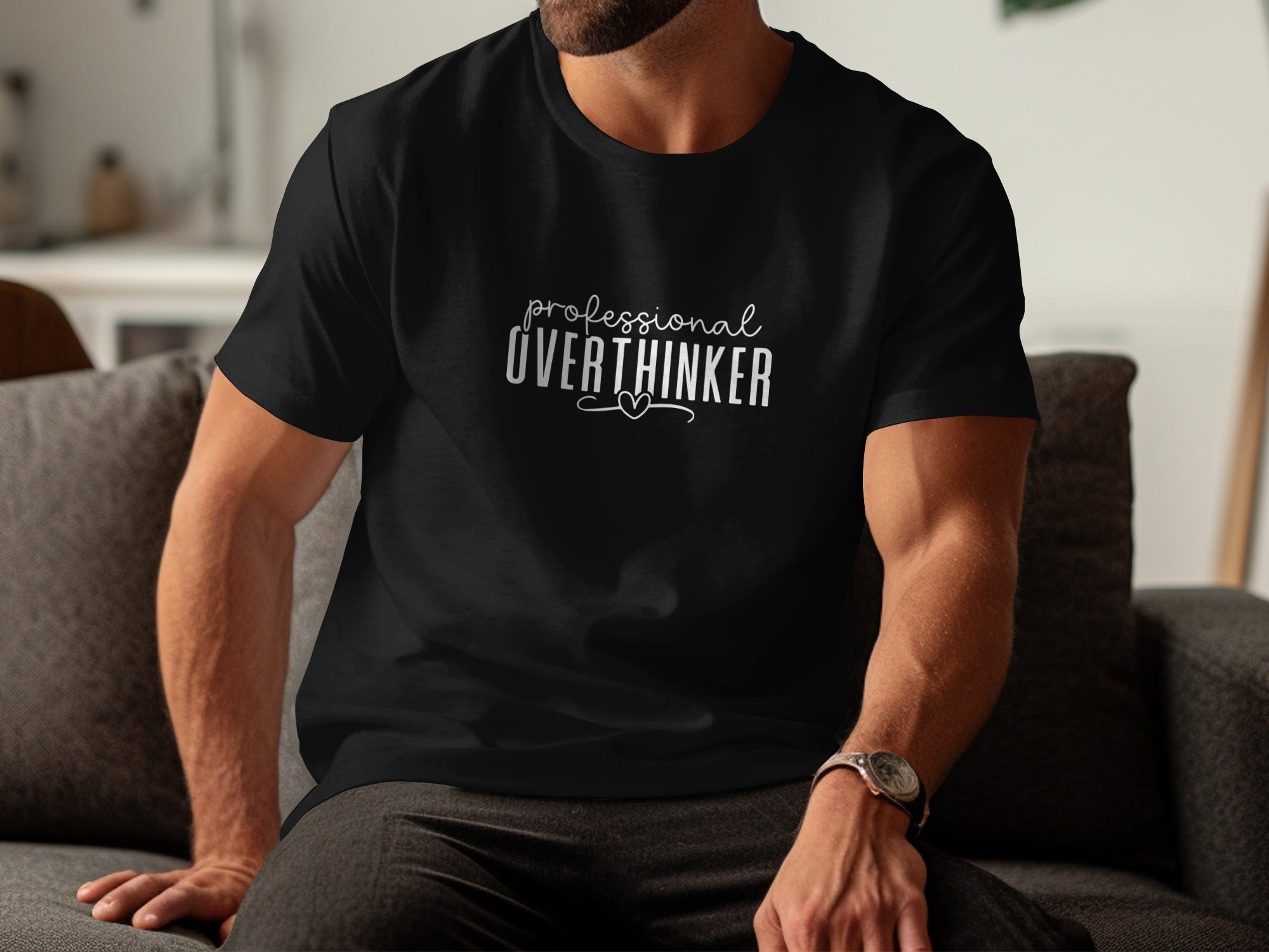 Black t-shirt with "professional overthinker" text and a small heart design.