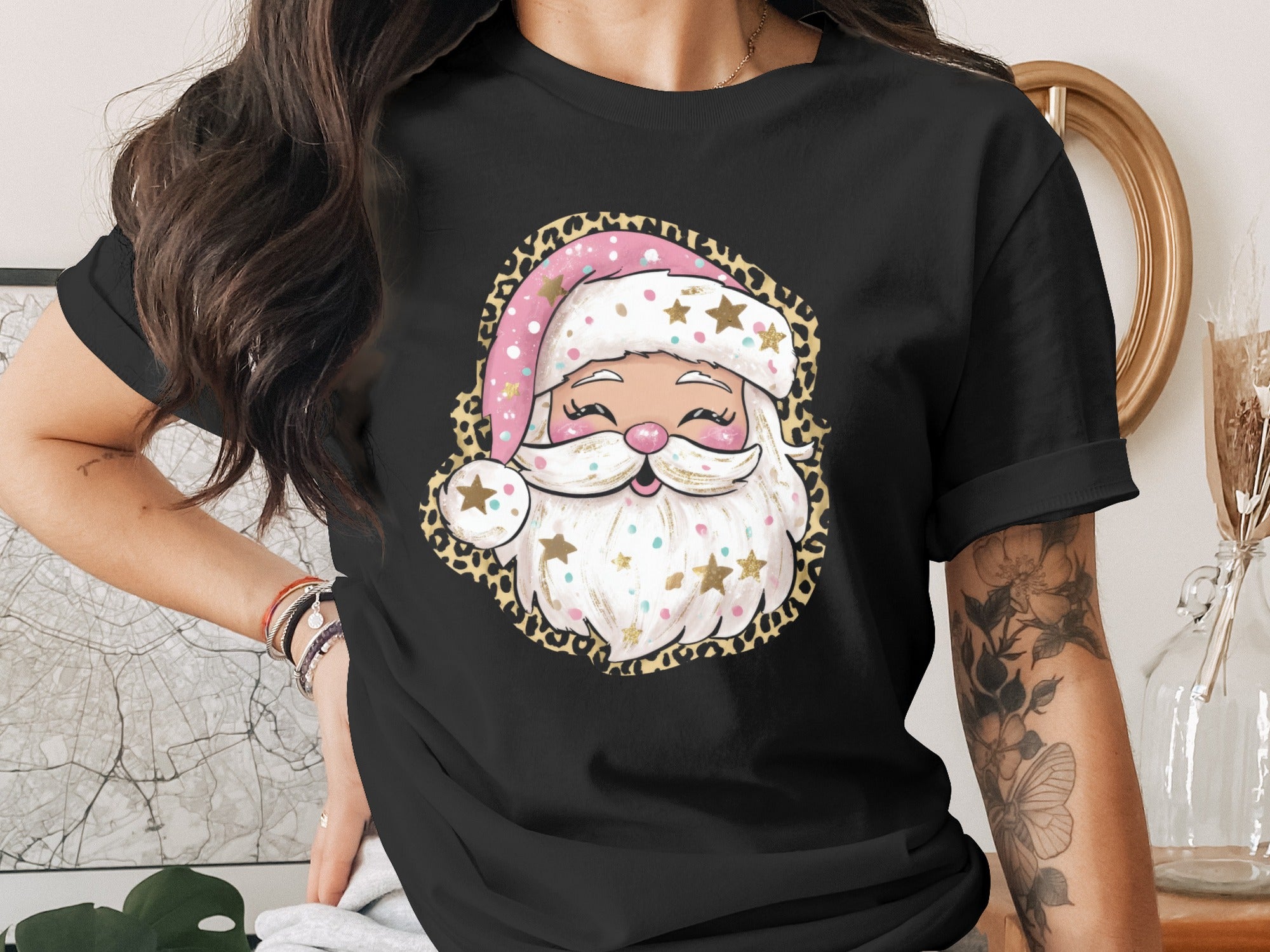 Black t-shirt with a cartoon Santa Claus face and leopard print frame.