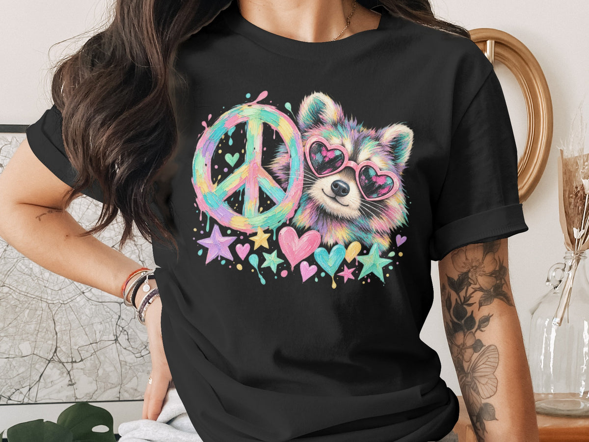 Black t-shirt with a colorful raccoon wearing heart sunglasses and a peace sign.