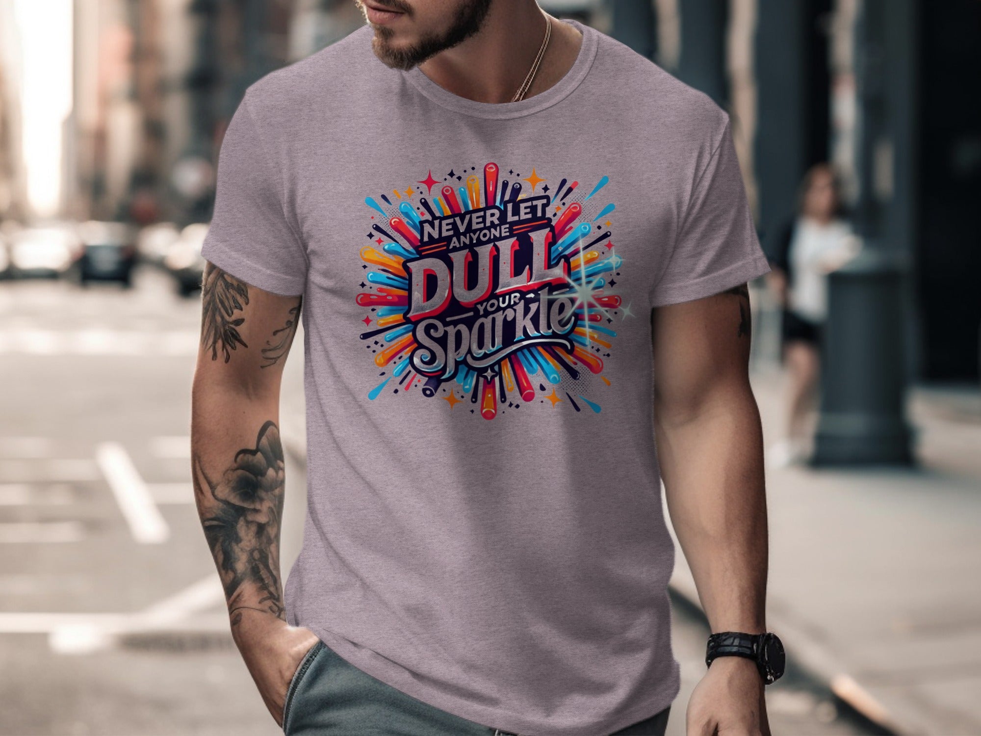 Men's lilac t-shirt with "Never Let Anyone Dull Your Sparkle" graphic