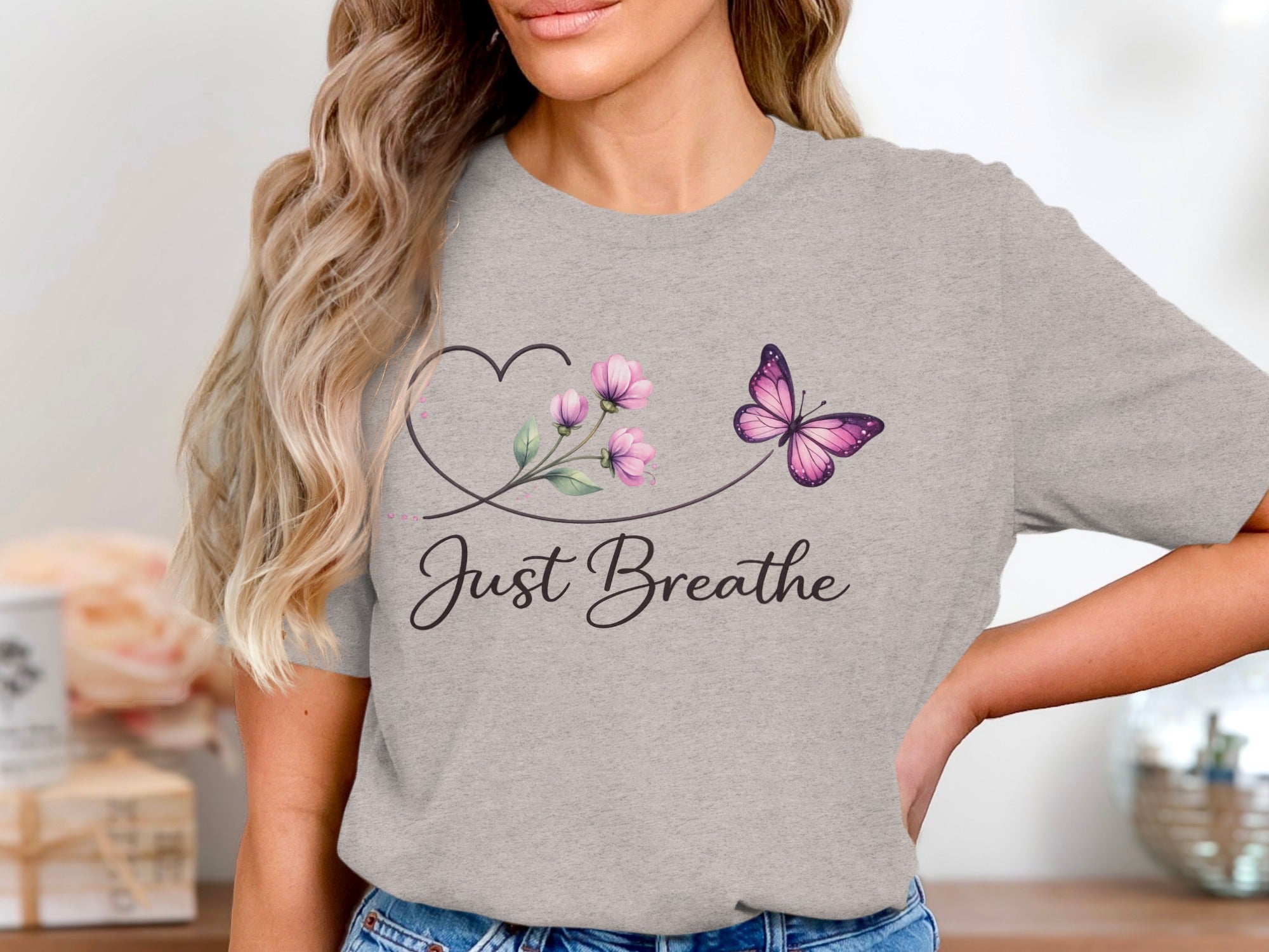 Grey t-shirt with butterfly, flowers, and "Just Breathe" text.