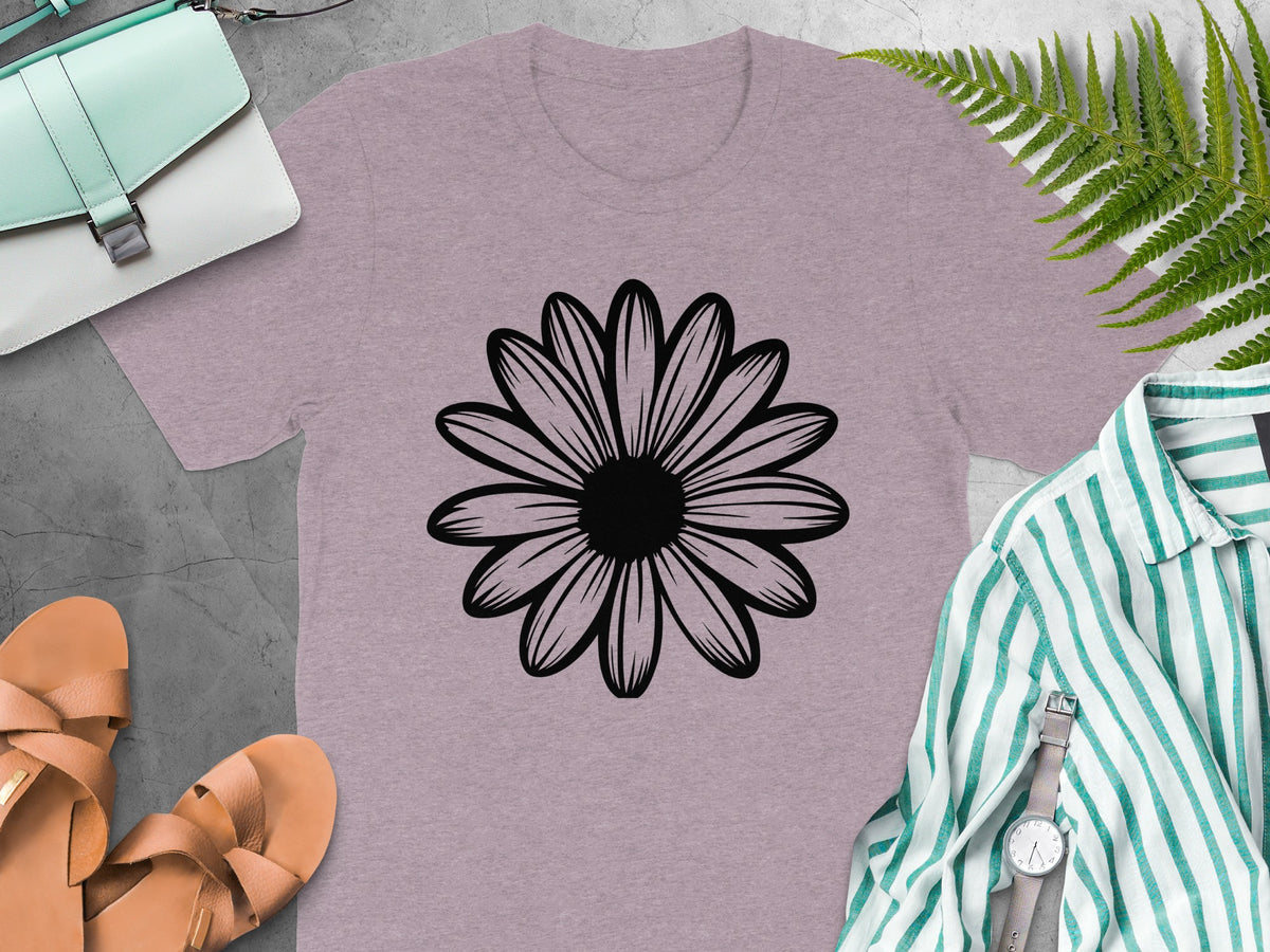 Dusty rose t-shirt with black daisy graphic, mint bag, and sandals.