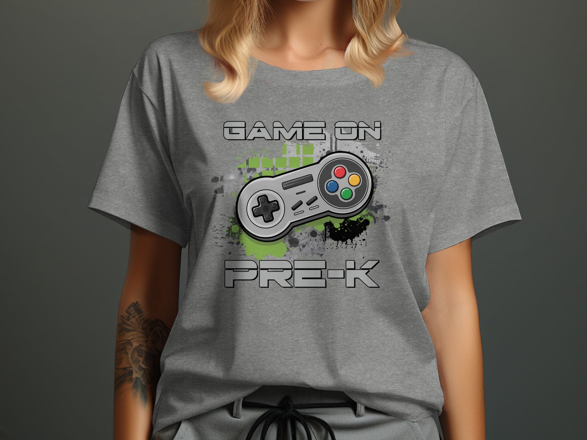 Grey t-shirt with a video game controller and "Game On Pre-K" text.