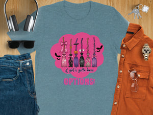Blue t-shirt with Halloween brooms and pink lettering saying "A girl's gotta have OPTIONS!".