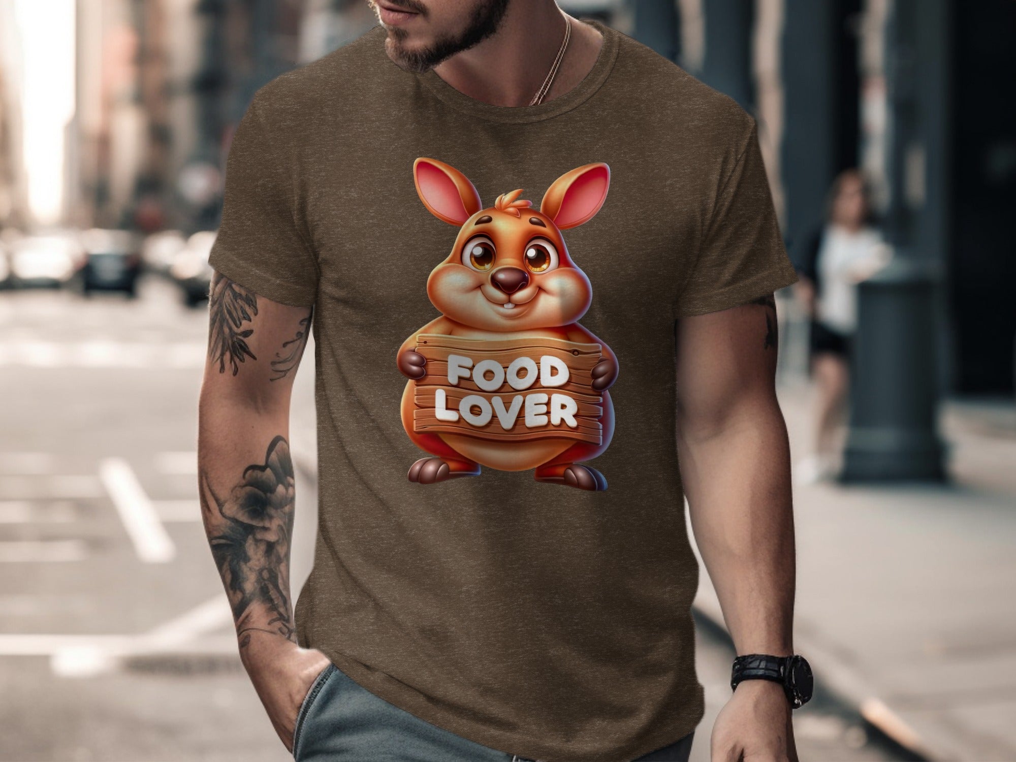 Brown t-shirt featuring a cartoon rodent holding a wooden sign that reads "FOOD LOVER".