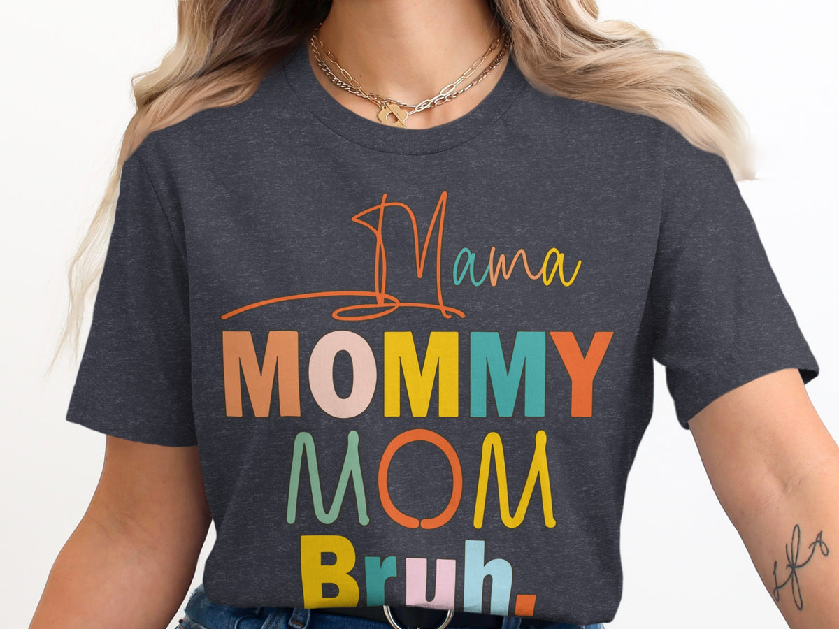 Dark gray t-shirt with "Mama Mommy Mom Bruh" text in colorful block letters.