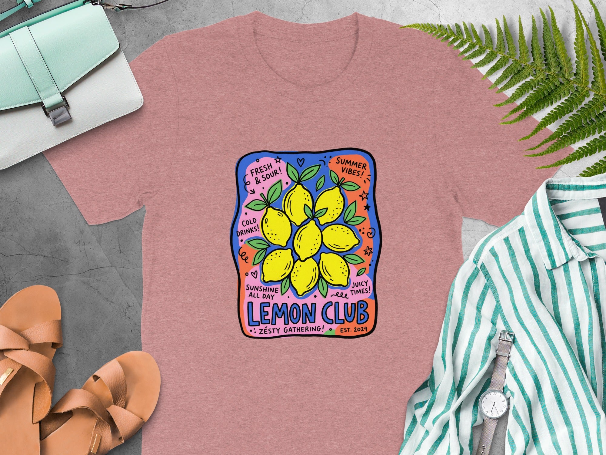 Pink t-shirt with "Lemon Club" graphic featuring lemons, text, and "Summer Vibes."