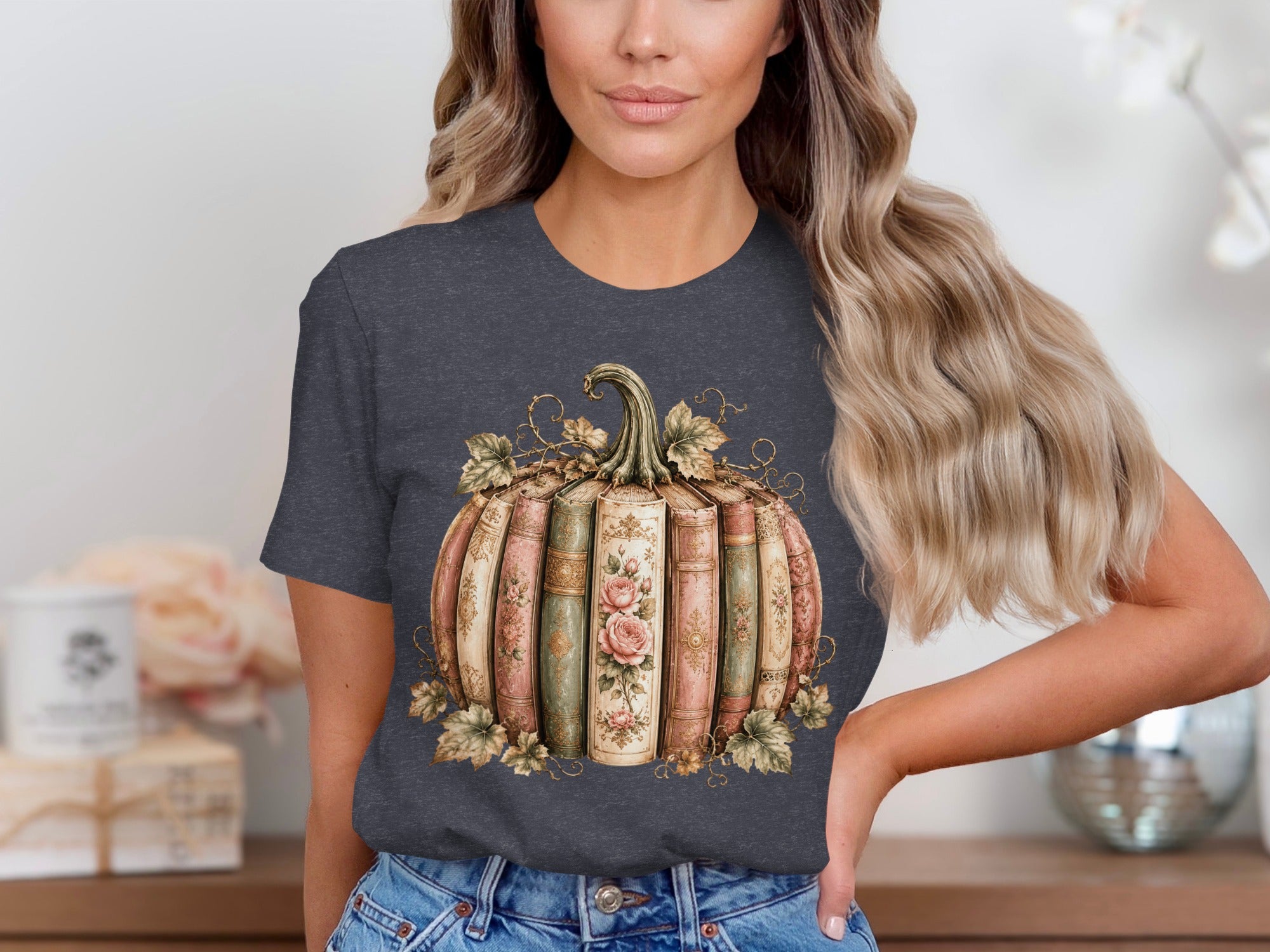 Pumpkin made of vintage books with roses and ivy graphic on t-shirt.