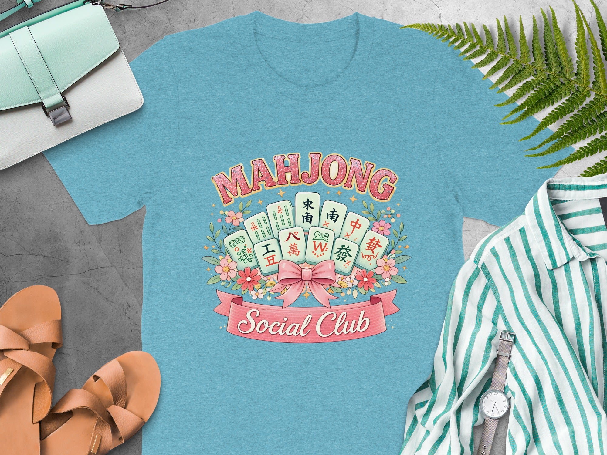 Mahjong tiles and text reading "Mahjong Social Club" on a blue t-shirt.
