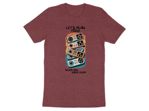 Maroon t-shirt with stacked video game controllers and text "LET'S PLAY NOW! NEVER SAY GAME OVER!".