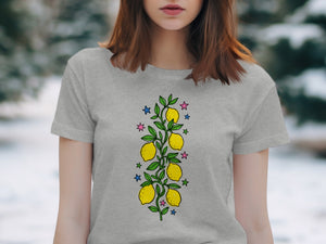 Grey t-shirt with a colorful lemon branch and star graphic.