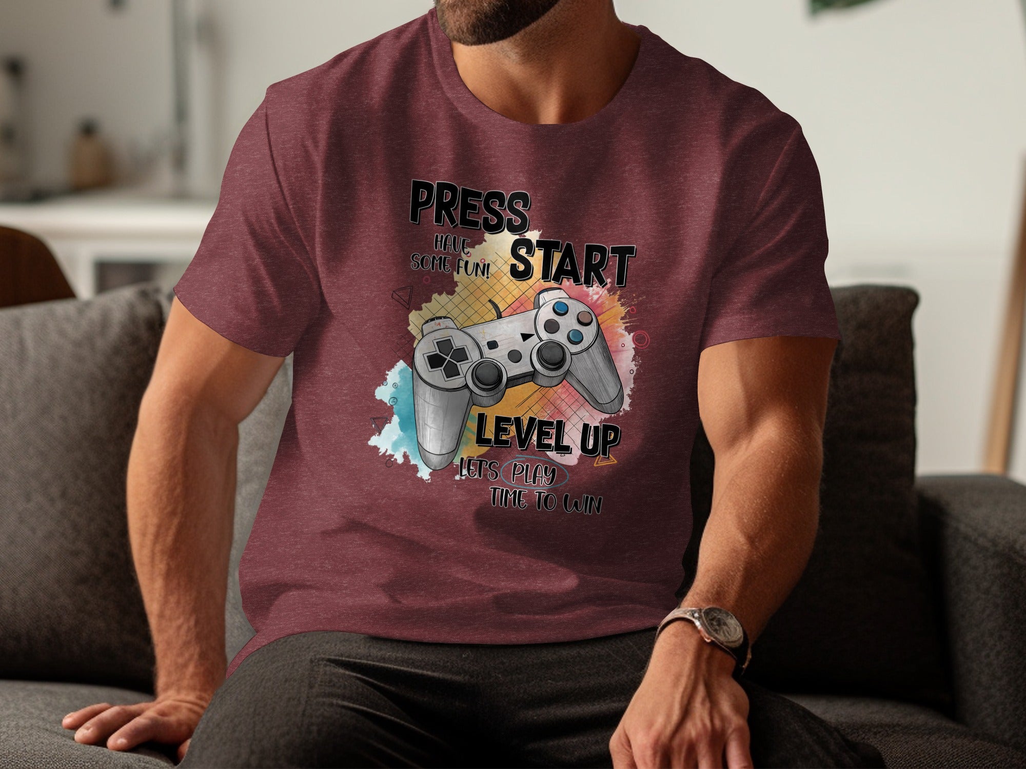 Maroon t-shirt with "PRESS START HAVE SOME FUN! LEVEL UP LET'S PLAY TIME TO WIN" and a video game controller.