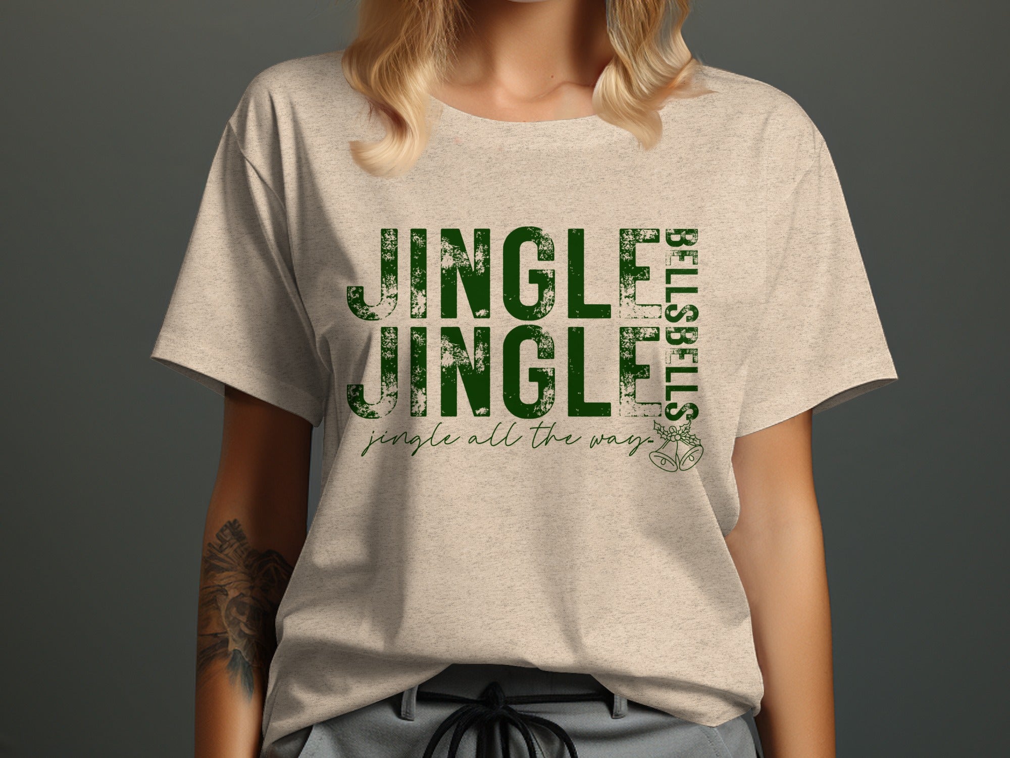 Light beige t-shirt with green text "Jingle Jingle" and "Jingle all the way".