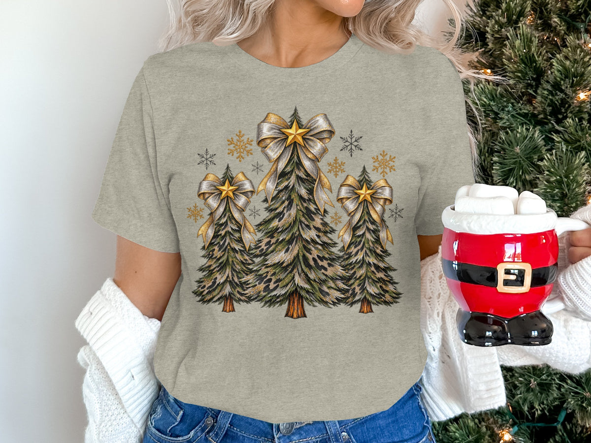 Grey t-shirt with leopard print Christmas trees, gold bows, stars, and snowflakes.
