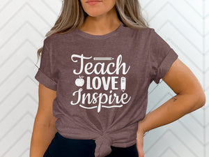 Brown t-shirt with distressed white text: Teach Love Inspire.