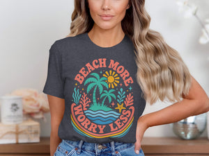 Dark grey t-shirt with retro beach graphic and text "Beach more worry less".
