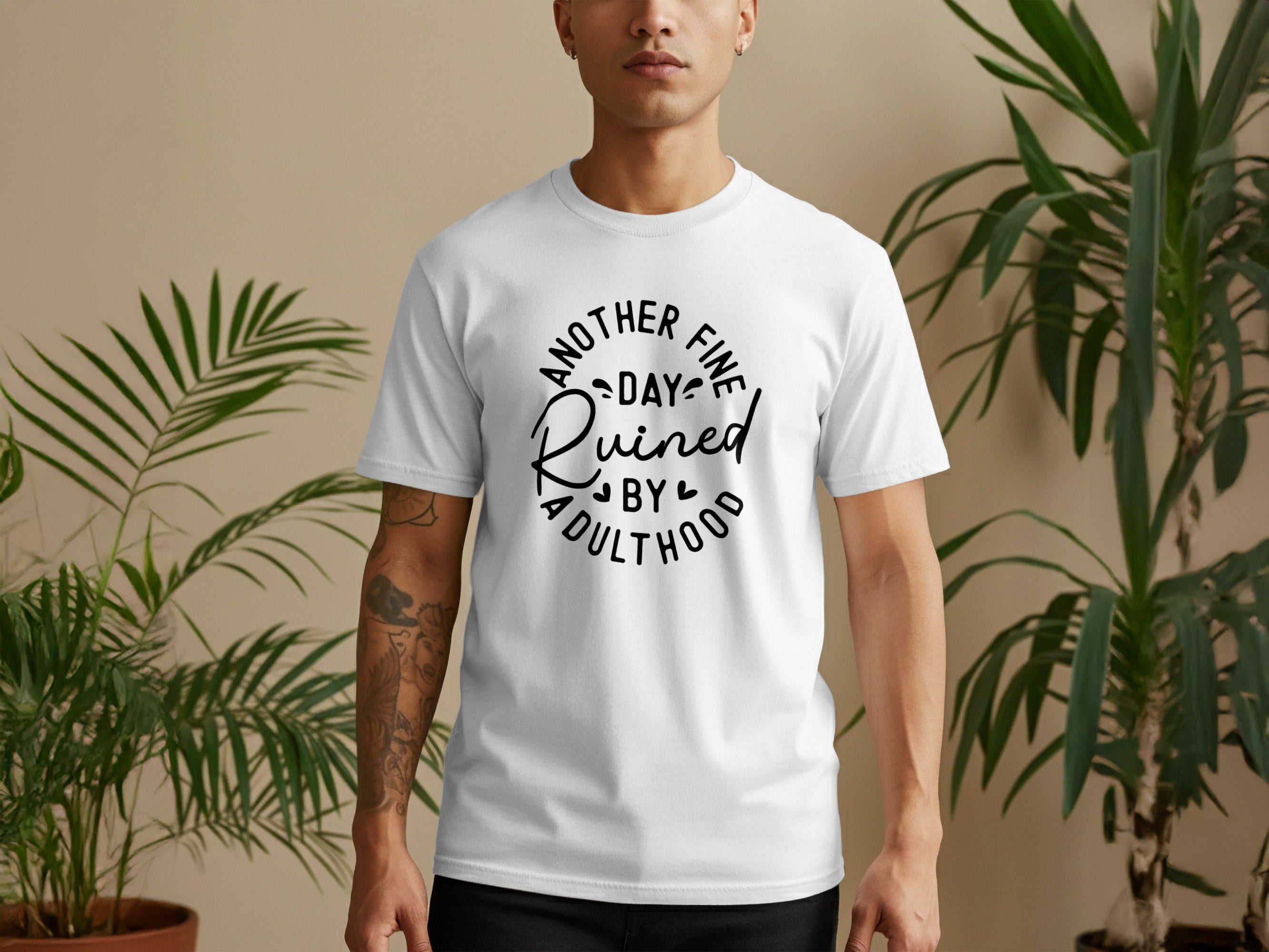 White t-shirt with black text reading "Another Fine Day Ruined by Adulthood".