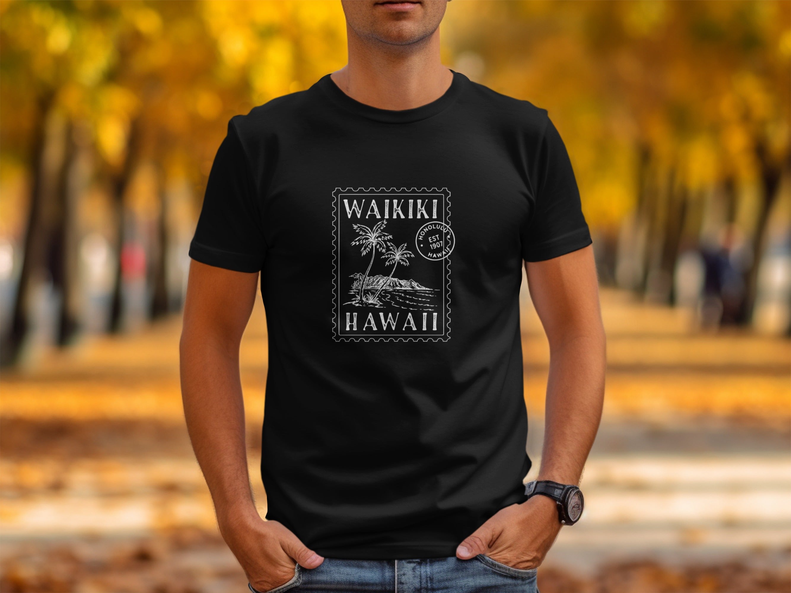 Black t-shirt with white Waikiki Hawaii stamp graphic, palm trees, Honolul. Est 1907.