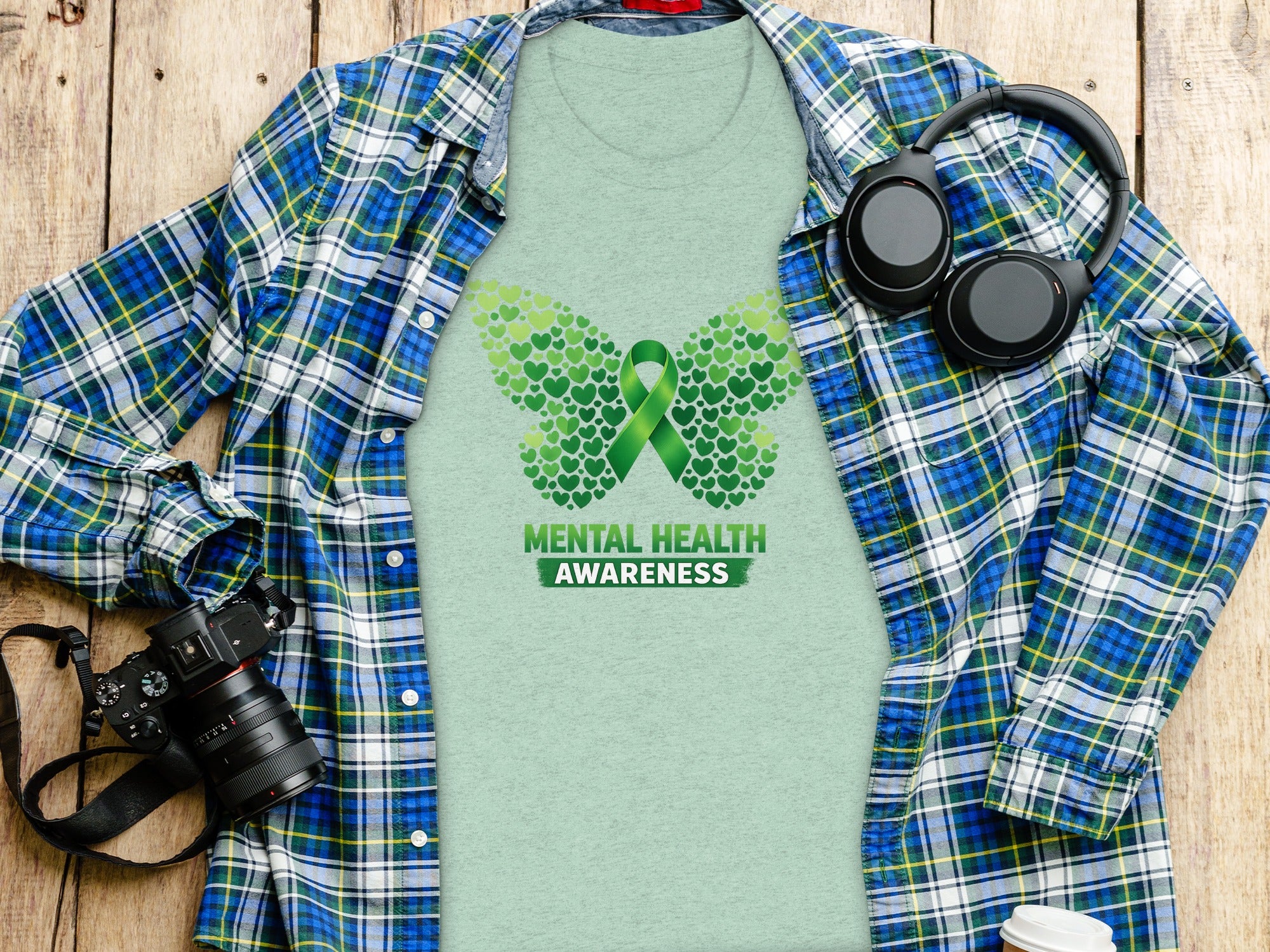 Green t-shirt with butterfly made of hearts and "Mental Health Awareness".