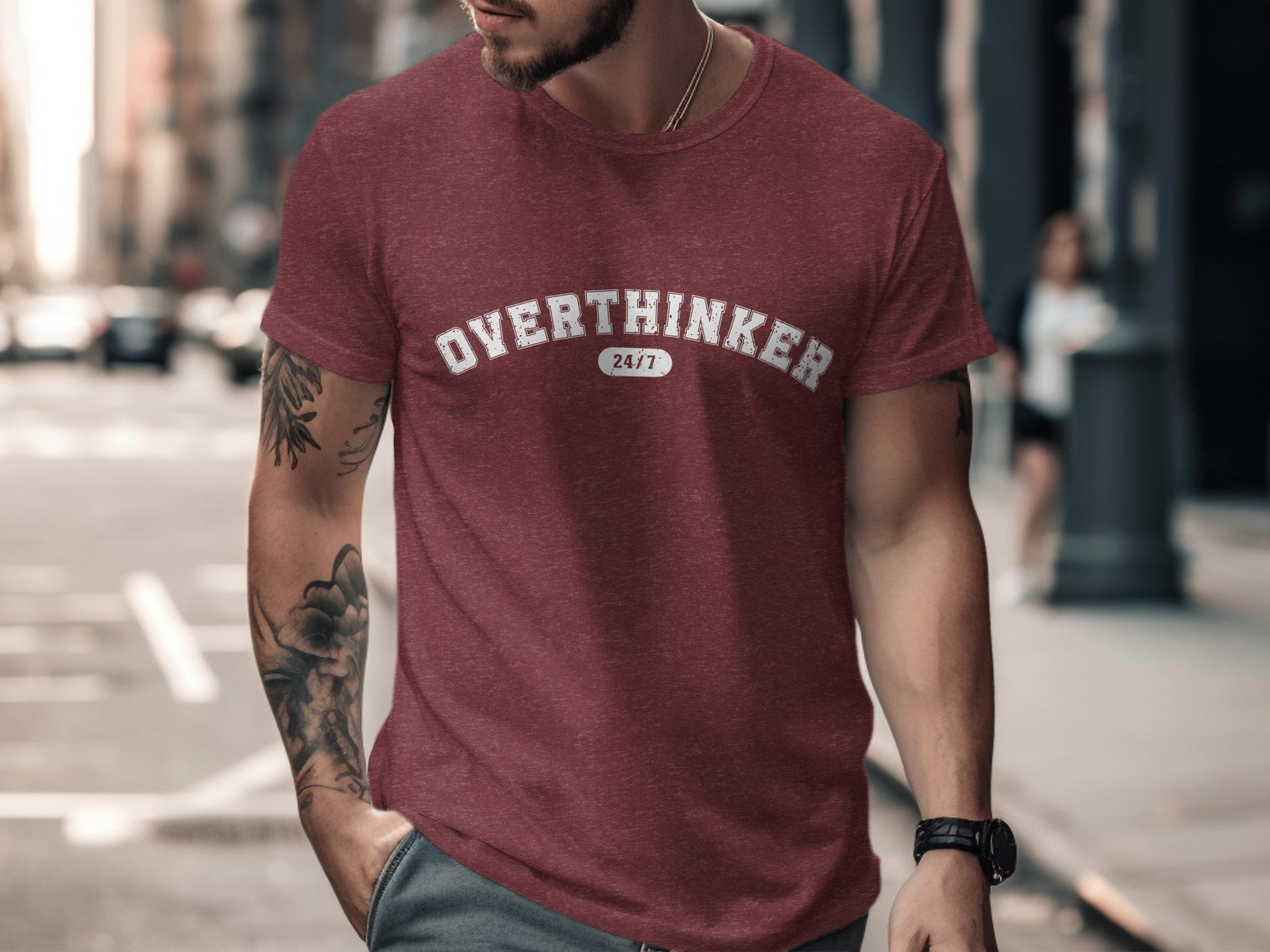 Maroon t-shirt with white distressed text "OVERTHINKER 24/7" worn by a man.