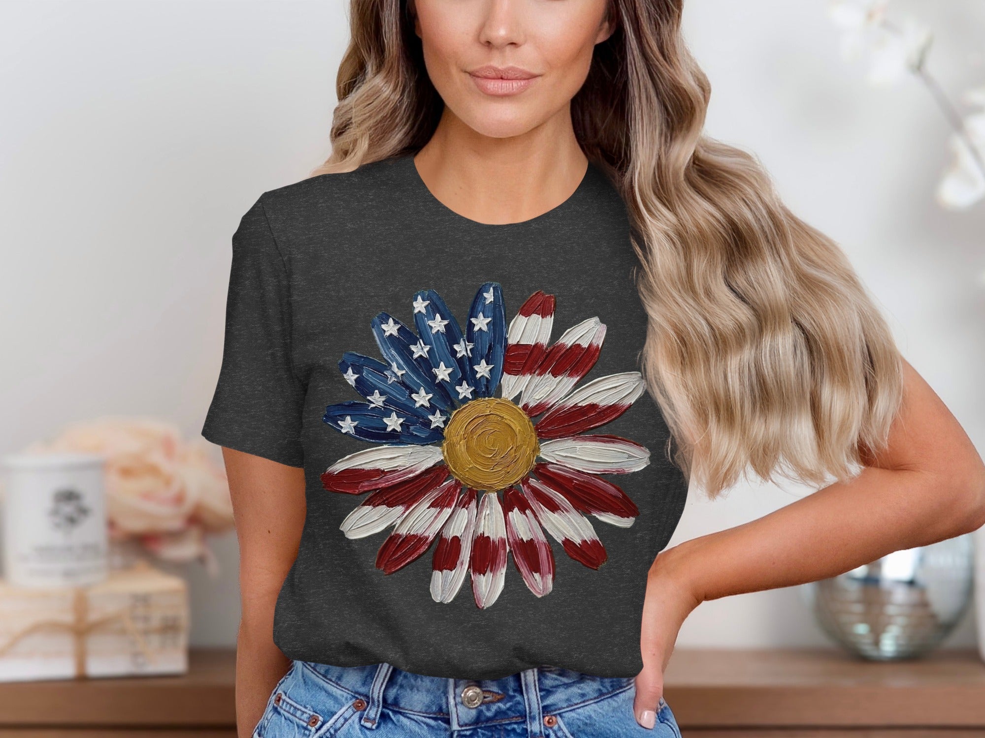 Girl wearing dark t-shirt with American flag daisy graphic.