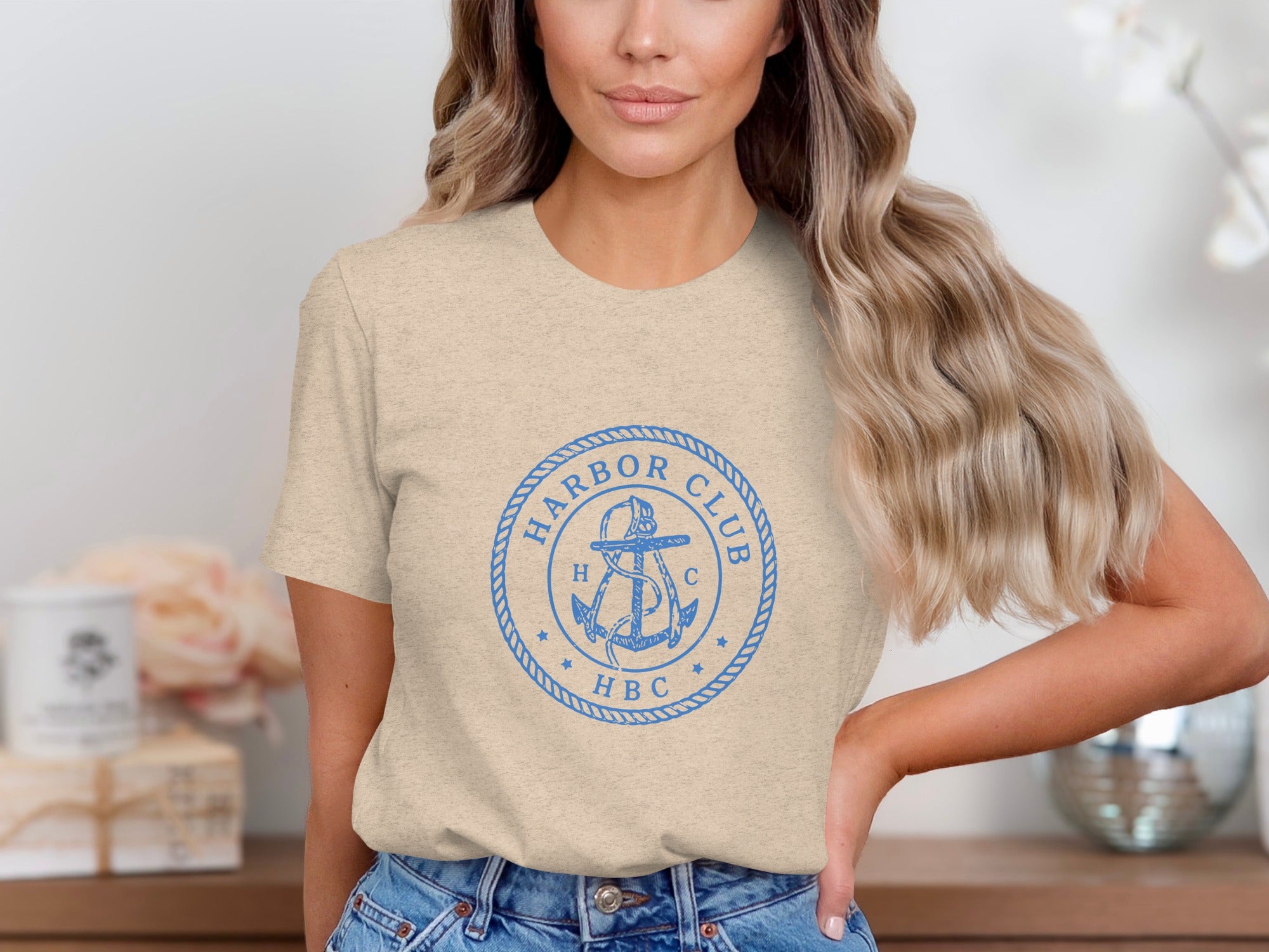 T-shirt with blue "Harbor Club HBC" circular anchor logo.