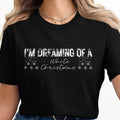 Black t-shirt with "I'm Dreaming of a White Christmas" text and snowflakes.
