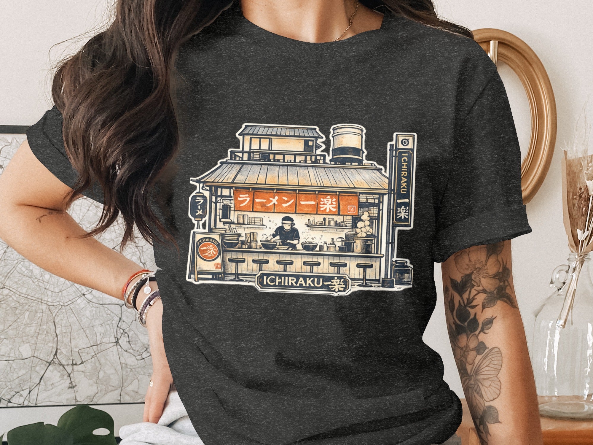 Illustration of Ichiraku ramen shop with chef, text reads Ichiraku Ramen.