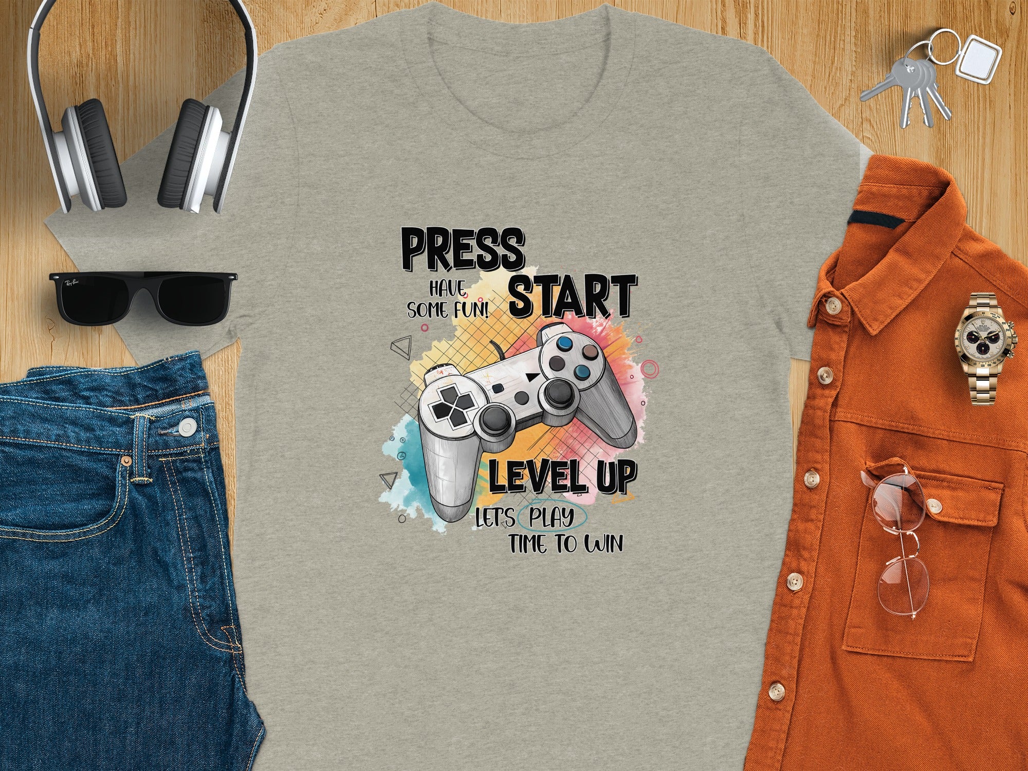 Gray t-shirt featuring a video game controller graphic with text "Level Up".
