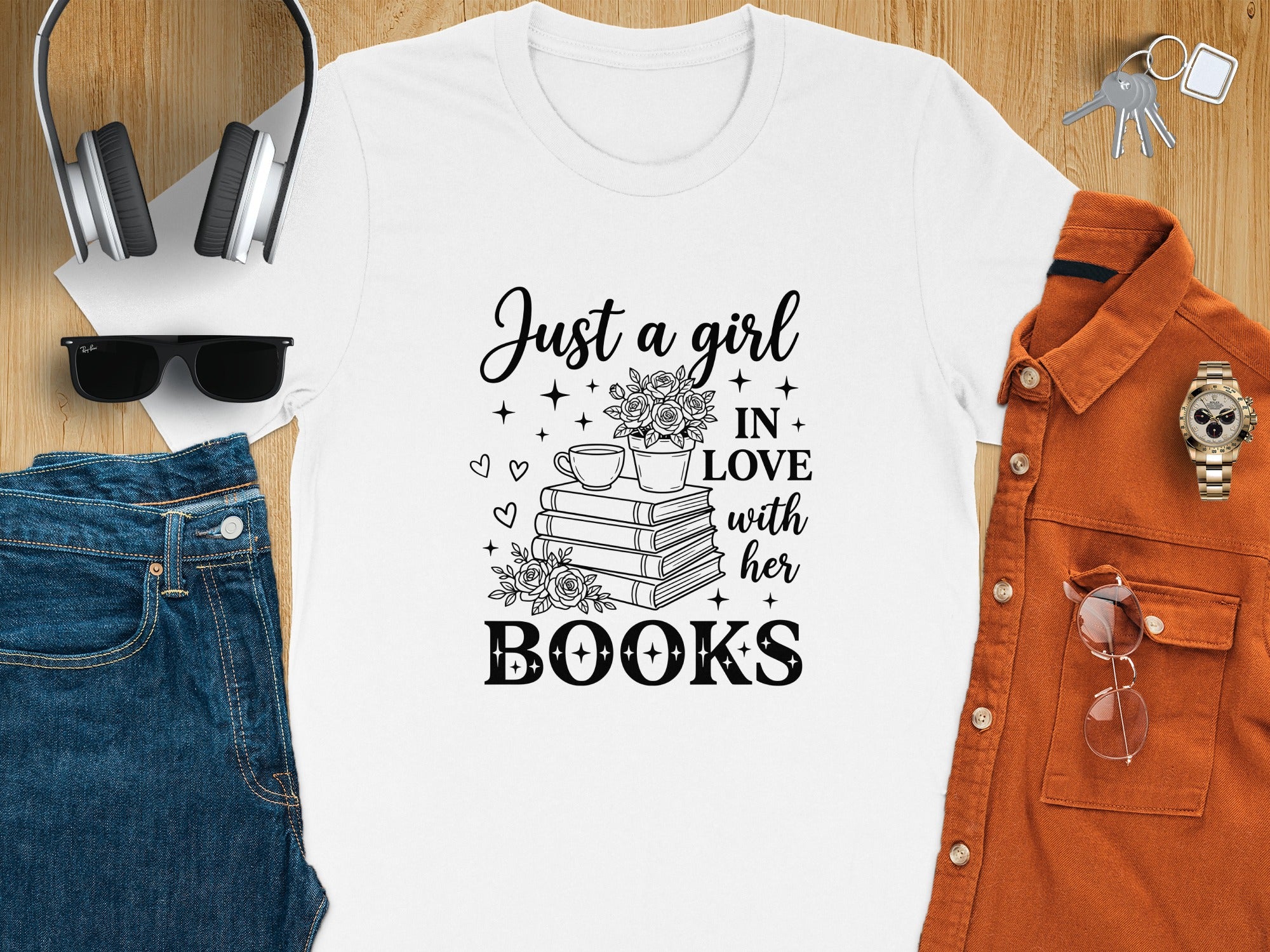 White t-shirt with "Just a girl IN LOVE with her BOOKS" graphic.